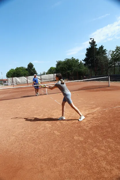 A girl with a racket on the clay court